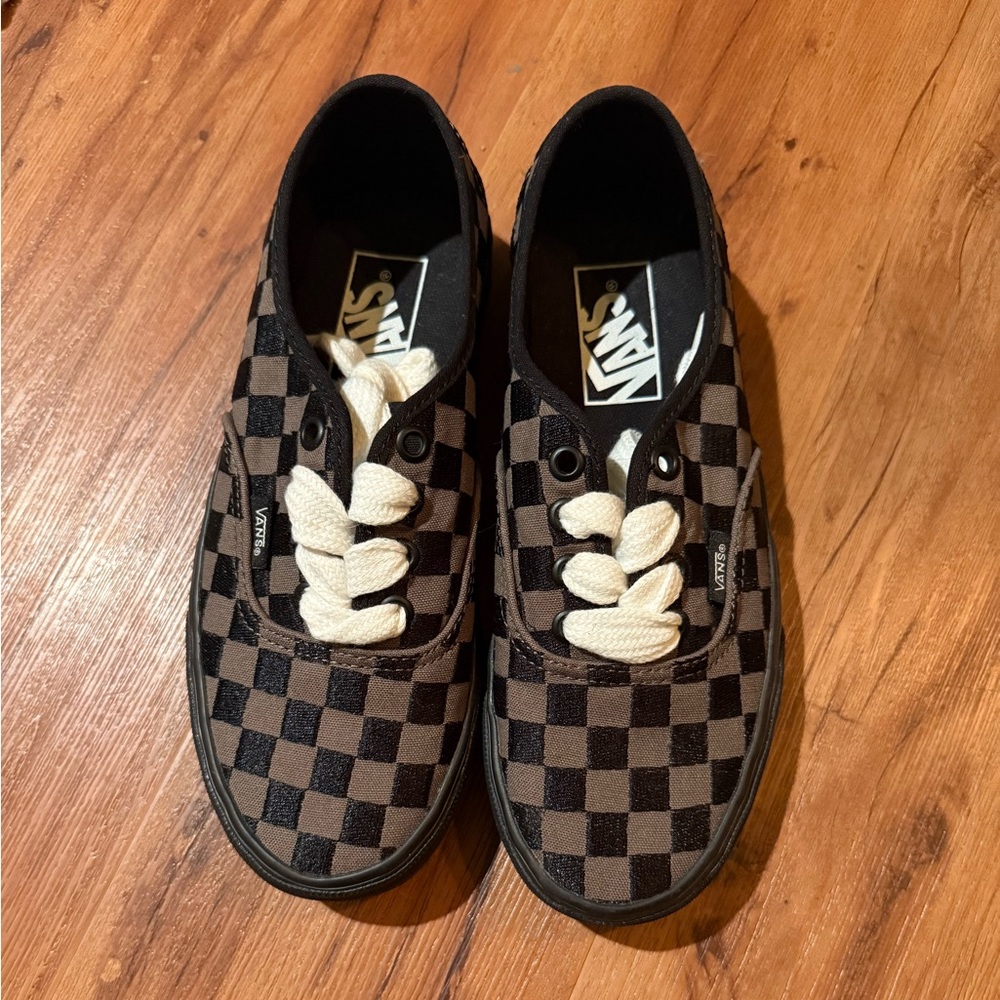 Black and grey checkered vans. New without tags. Never worn.
